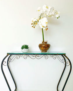 Close-up of white flower vase on table