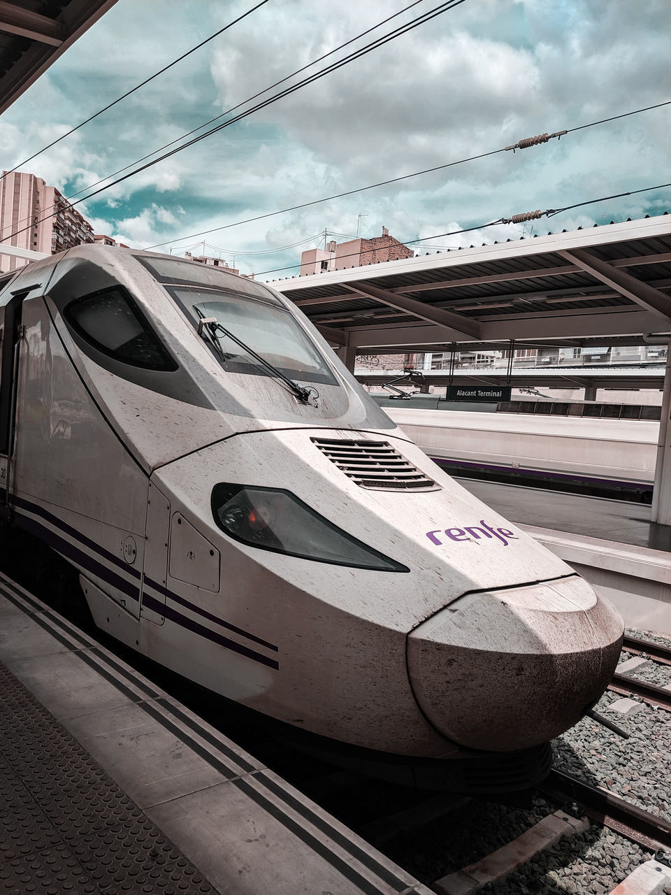VIEW OF RAILROAD STATION PLATFORM AGAINST SKY