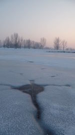 Scenic view of frozen lake against clear sky