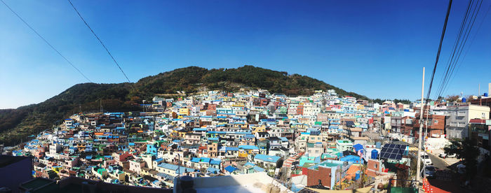 High angle view of townscape against blue sky