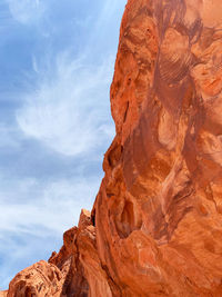 Low angle view of rock formation against sky