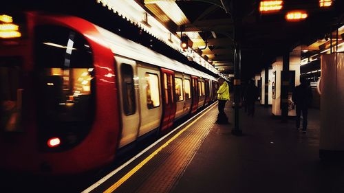 Train at railroad station at night