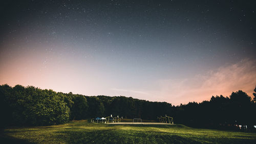 Scenic view of field against sky at night