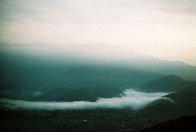 Scenic view of mountains against sky during winter