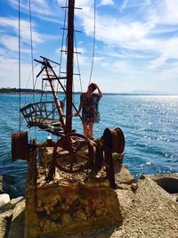 Scenic view of rocks on beach against sky