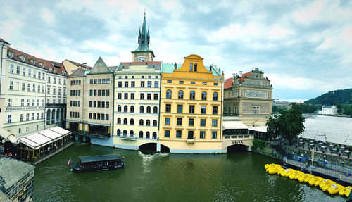 View of buildings against cloudy sky