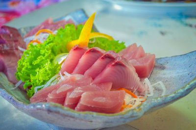 Close-up of fish served in plate on table