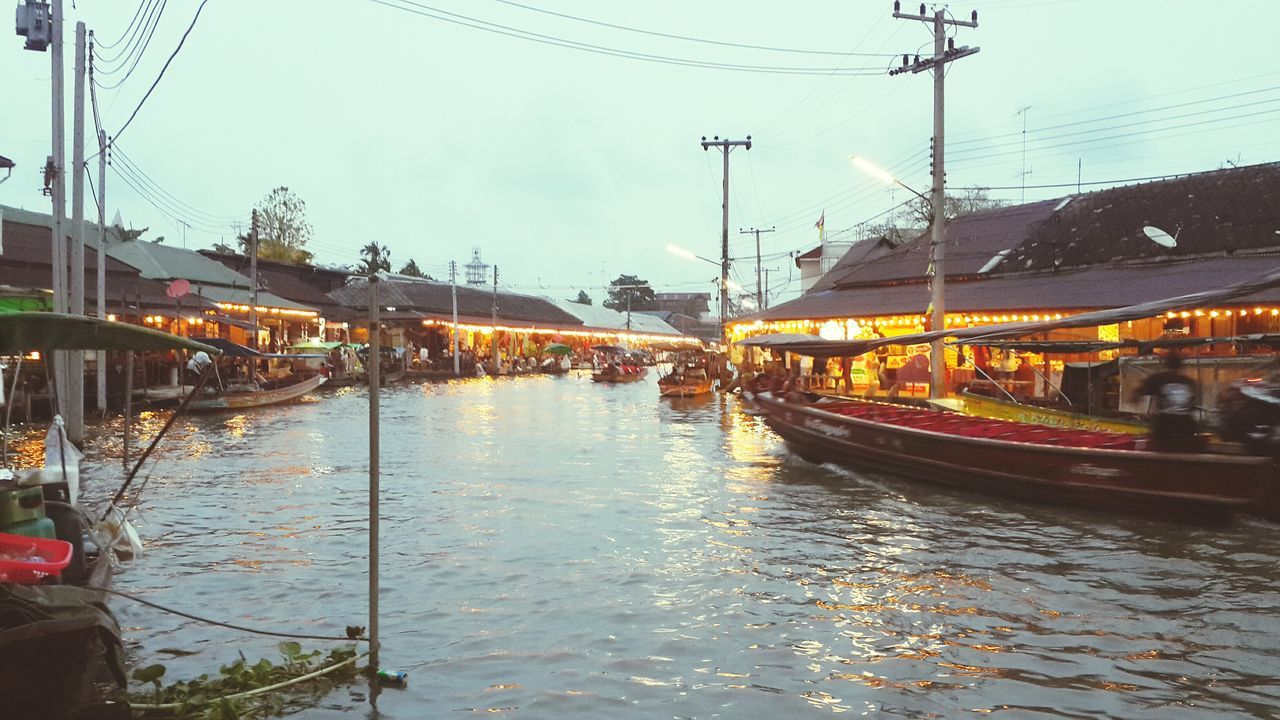 transportation, mode of transport, nautical vessel, water, boat, moored, reflection, waterfront, built structure, canal, sky, architecture, river, building exterior, power line, travel, connection, illuminated, outdoors, mast