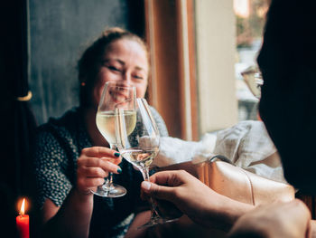 Women drinking water from glass at restaurant