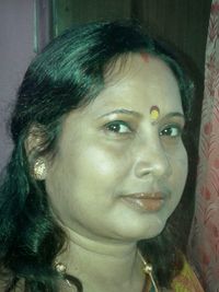 Close-up portrait of smiling young woman