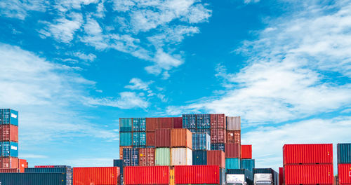 Stack of commercial dock against blue sky