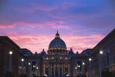 Low angle view of illuminated government building against sky during sunset