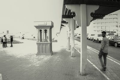 Full length of woman standing on railing