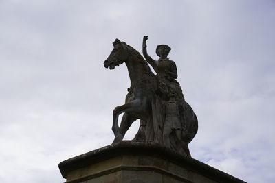 Low angle view of statue against sky