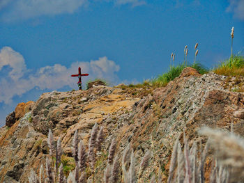 Low angle view of rock formation against sky