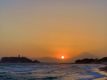 Scenic view of sea against sky during sunset