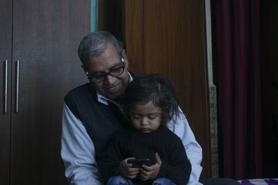 Grandfather playing with grandchild