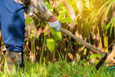 Low section of man working on field