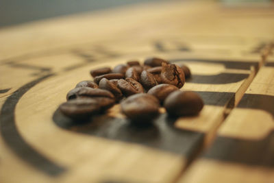 Close-up of coffee beans on table