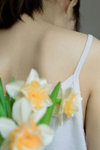 Close-up of woman holding flower bouquet