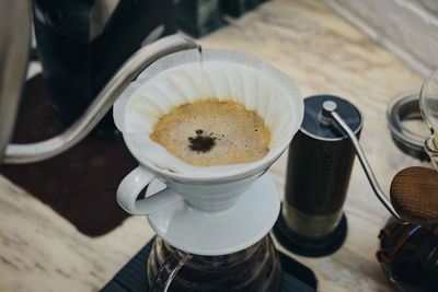 High angle view of coffee cups on table