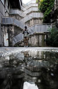 Reflection of building in puddle