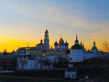 Buildings against sky during sunset