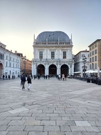 Piazza della loggia on a late saturday afternoon. brescia, lombardy, italy