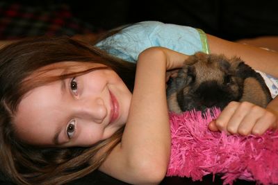 Portrait of girl with pet rabbit