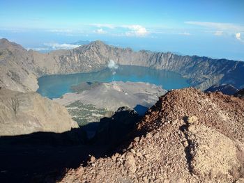 High angle view of mountain range against cloudy sky