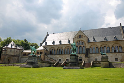 Church by building against sky