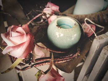 Close-up of container by flower