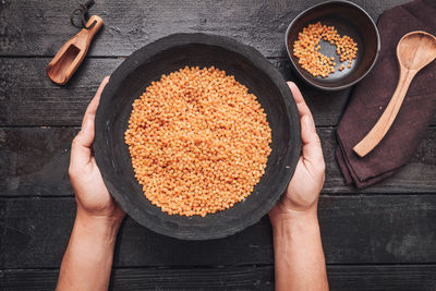 Directly above shot of person preparing food on table