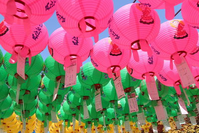 Multi colored lanterns hanging against sky