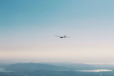 Airplane flying over landscape