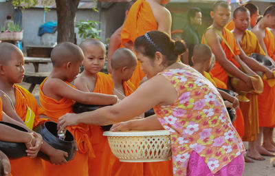 Group of people at market stall