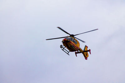 Close-up of helicopter against sky