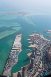 High angle view of city by sea