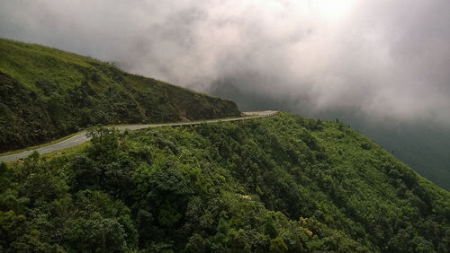 Scenic view of green landscape against sky