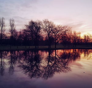 Scenic view of lake against sky during sunset