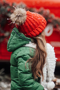 Rear view of girl looking away