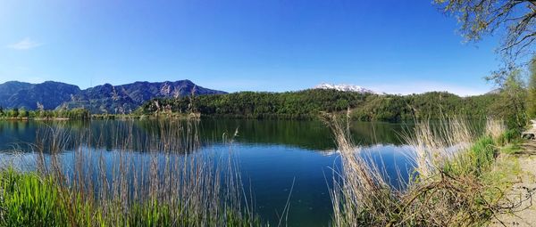 Scenic view of lake against blue sky