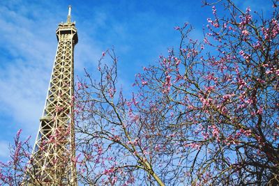 Low angle view of tower against blue sky