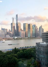 Modern buildings in city against sky