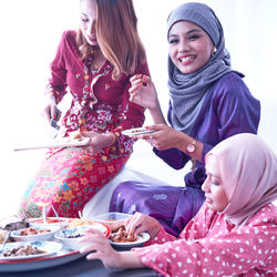 Friends and family enjoying festival meal during the eid celebration