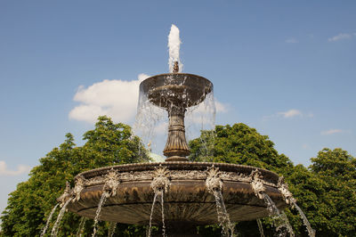 Low angle view of fountain against sky