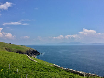 Scenic view of sea against blue sky