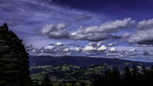 Scenic view of mountains against sky at dusk