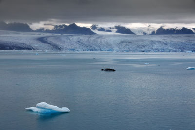 Scenic view of sea against sky during winter