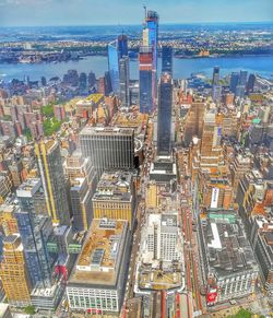 High angle view of modern buildings in city against sky